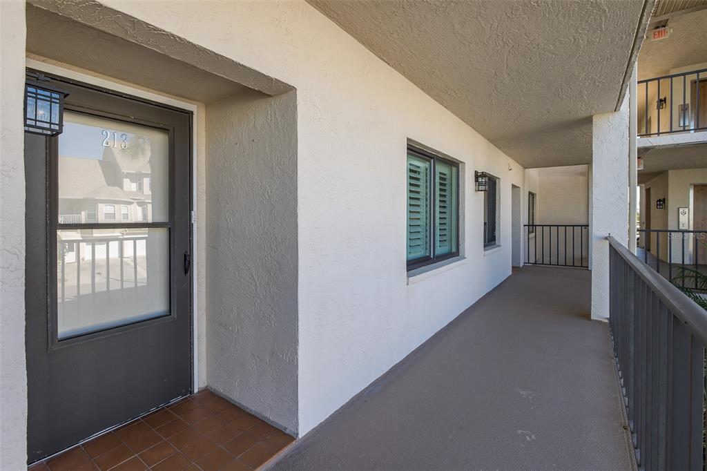 8210 Aquila Street, Unit 213 Port Richey, FL 34668 - Photo 6 of 48 a view of livingroom with furniture and windows
