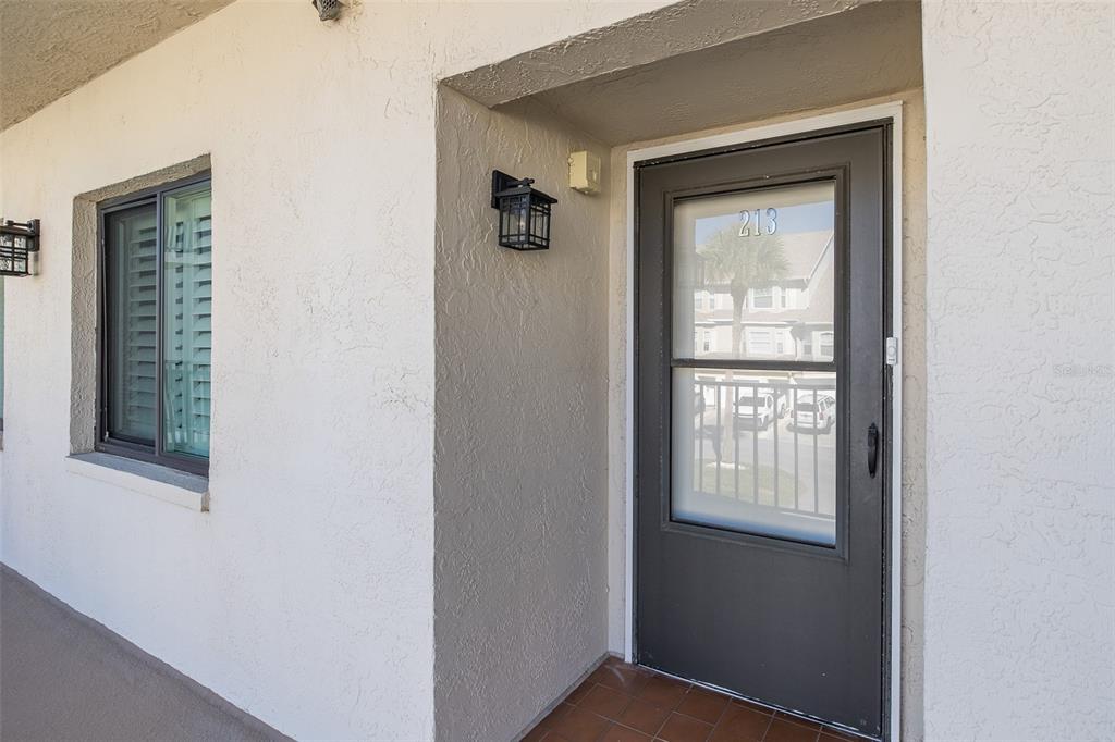 8210 Aquila Street, Unit 213 Port Richey, FL 34668 - Photo 7 of 48 a view of an front door