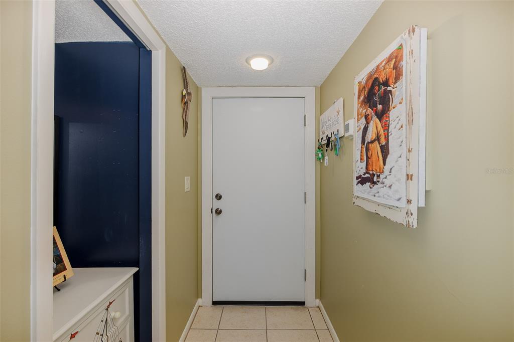 8210 Aquila Street, Unit 213 Port Richey, FL 34668 - Photo 8 of 48 a view of a hallway