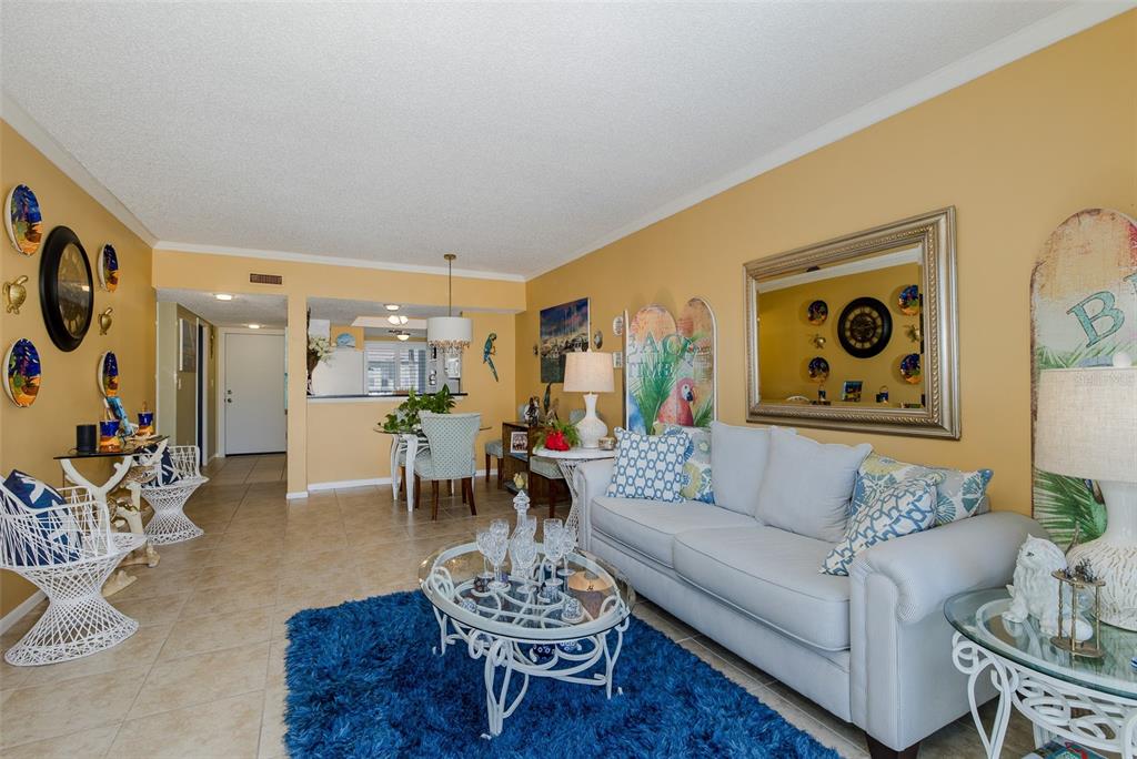8210 Aquila Street, Unit 213 Port Richey, FL 34668 - Photo 9 of 48 a living room with furniture and wooden floor