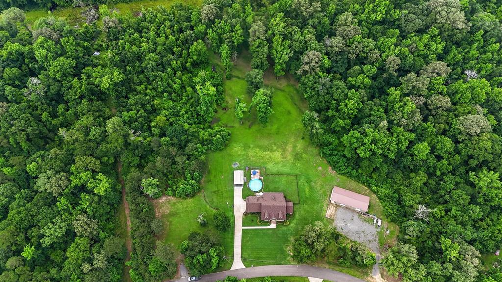 11868 Timber Ridge Drive Keithville, LA 71047 - Photo 3 of 37 Expansive property featuring a main residence, detached outbuilding, and an above-ground pool