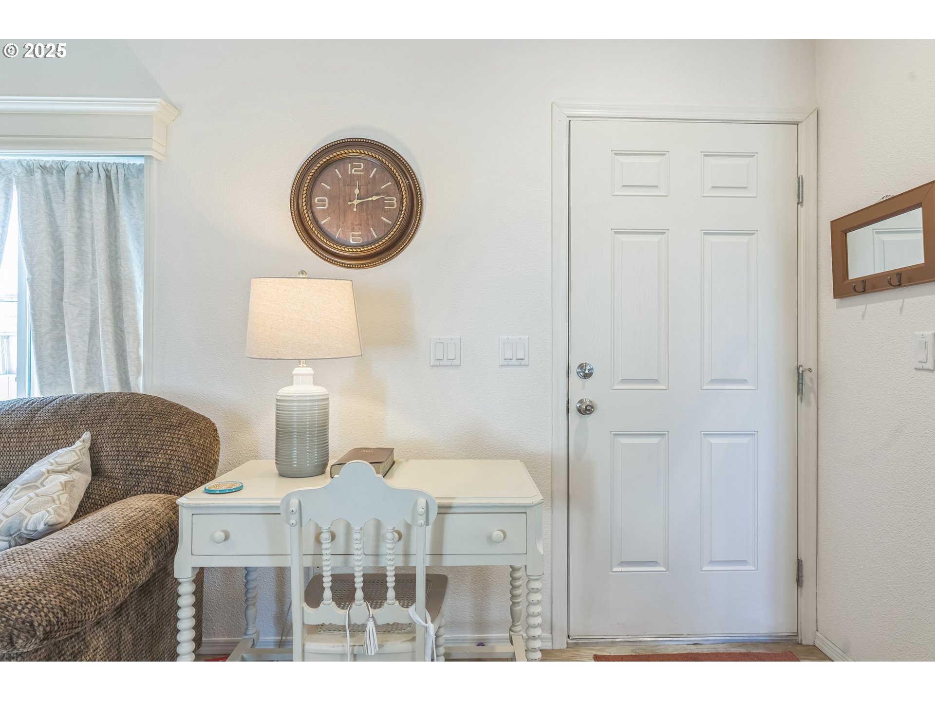 1999 Jansen Way, Unit 29 Woodburn, OR 97071 - Photo 12 of 33 a living room with furniture a clock and a window