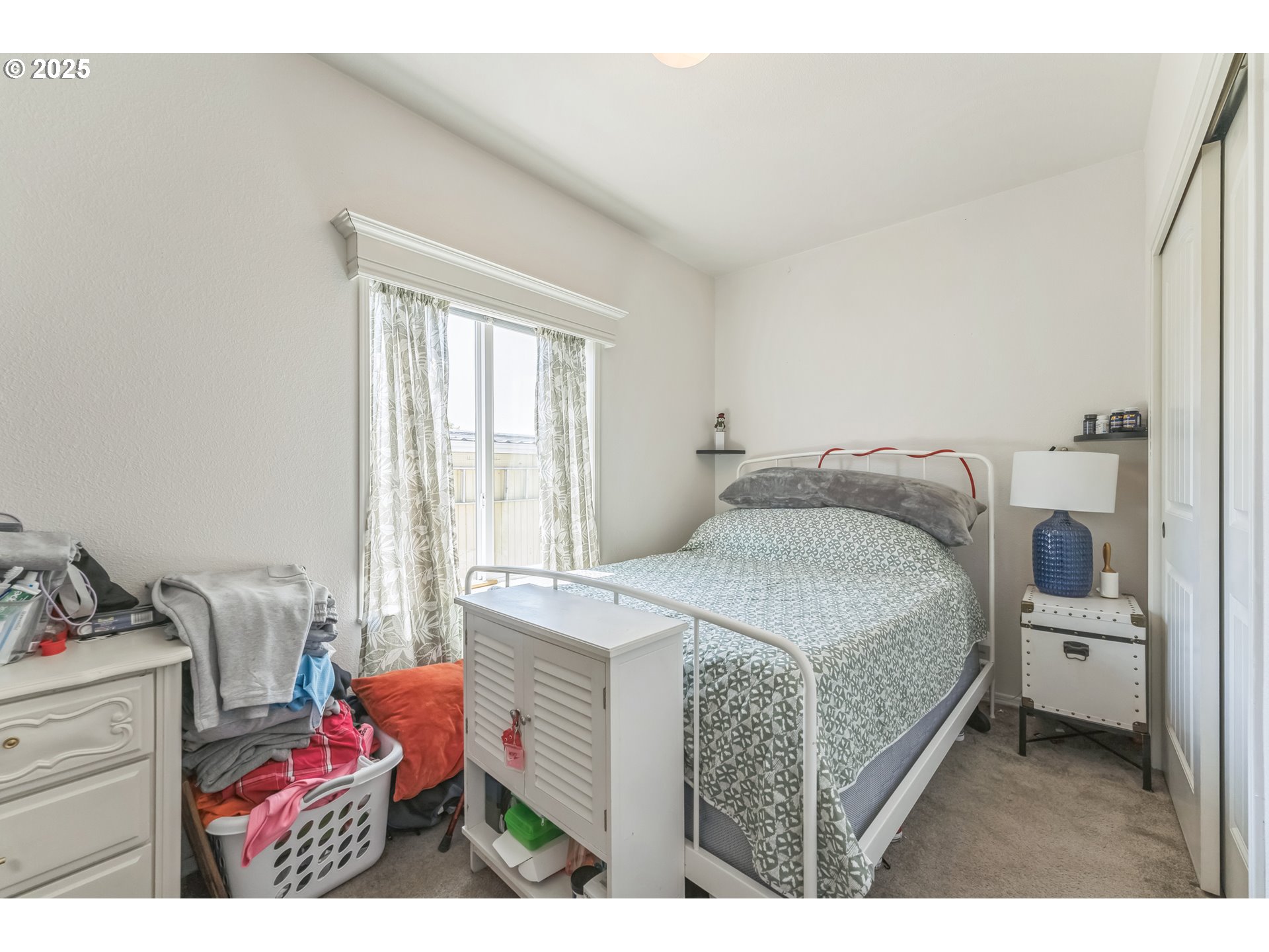 1999 Jansen Way, Unit 29 Woodburn, OR 97071 - Photo 23 of 33 a bedroom with a bed and a window