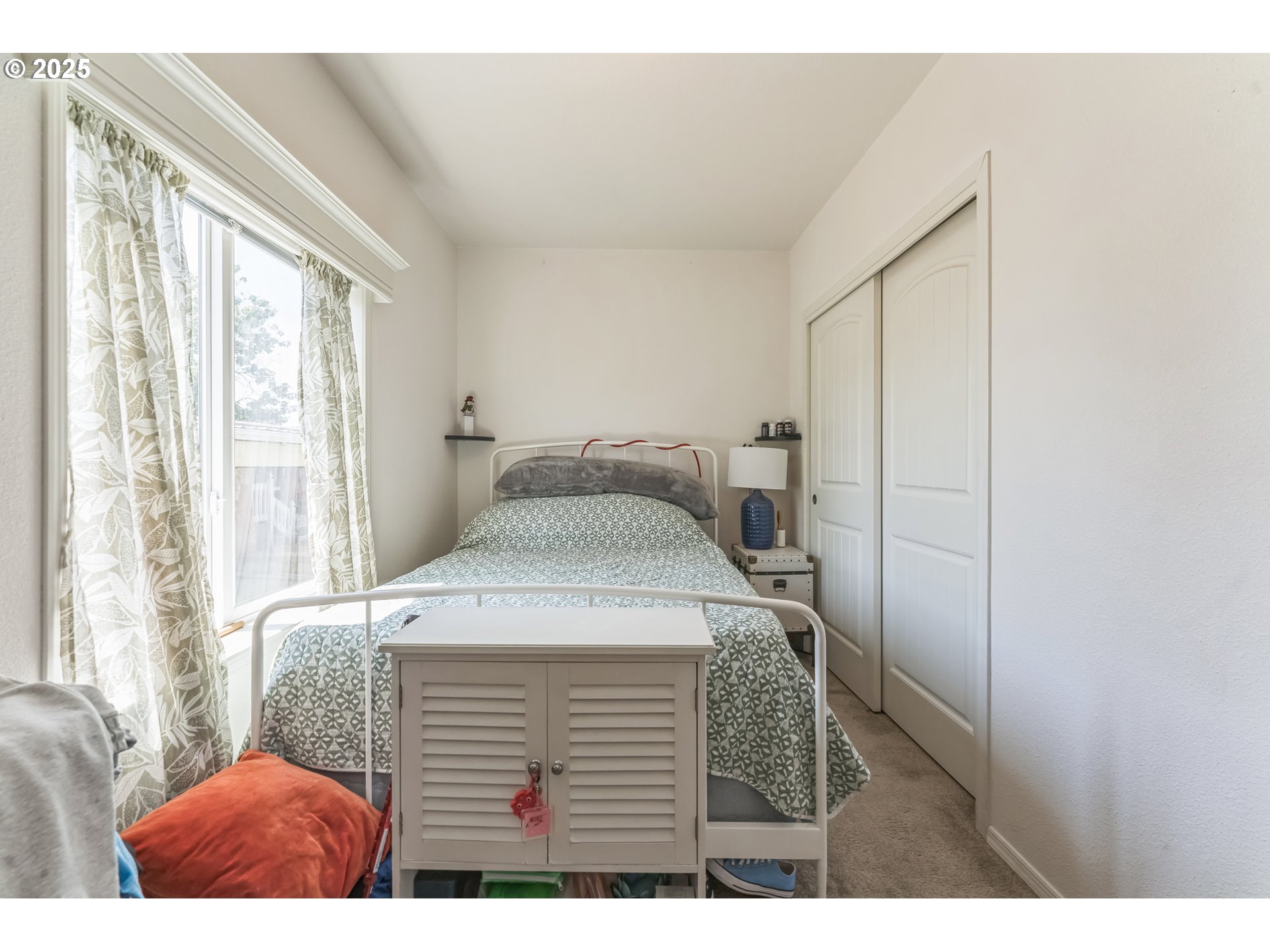 1999 Jansen Way, Unit 29 Woodburn, OR 97071 - Photo 24 of 33 a bedroom with a bed and a window
