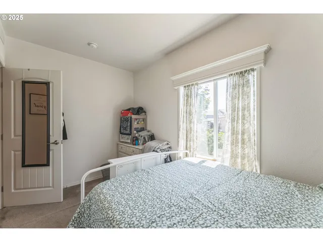 a bedroom with a bed and with furniture