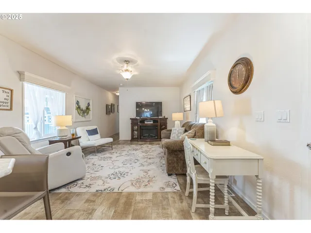 a living room with furniture a couch and dresser