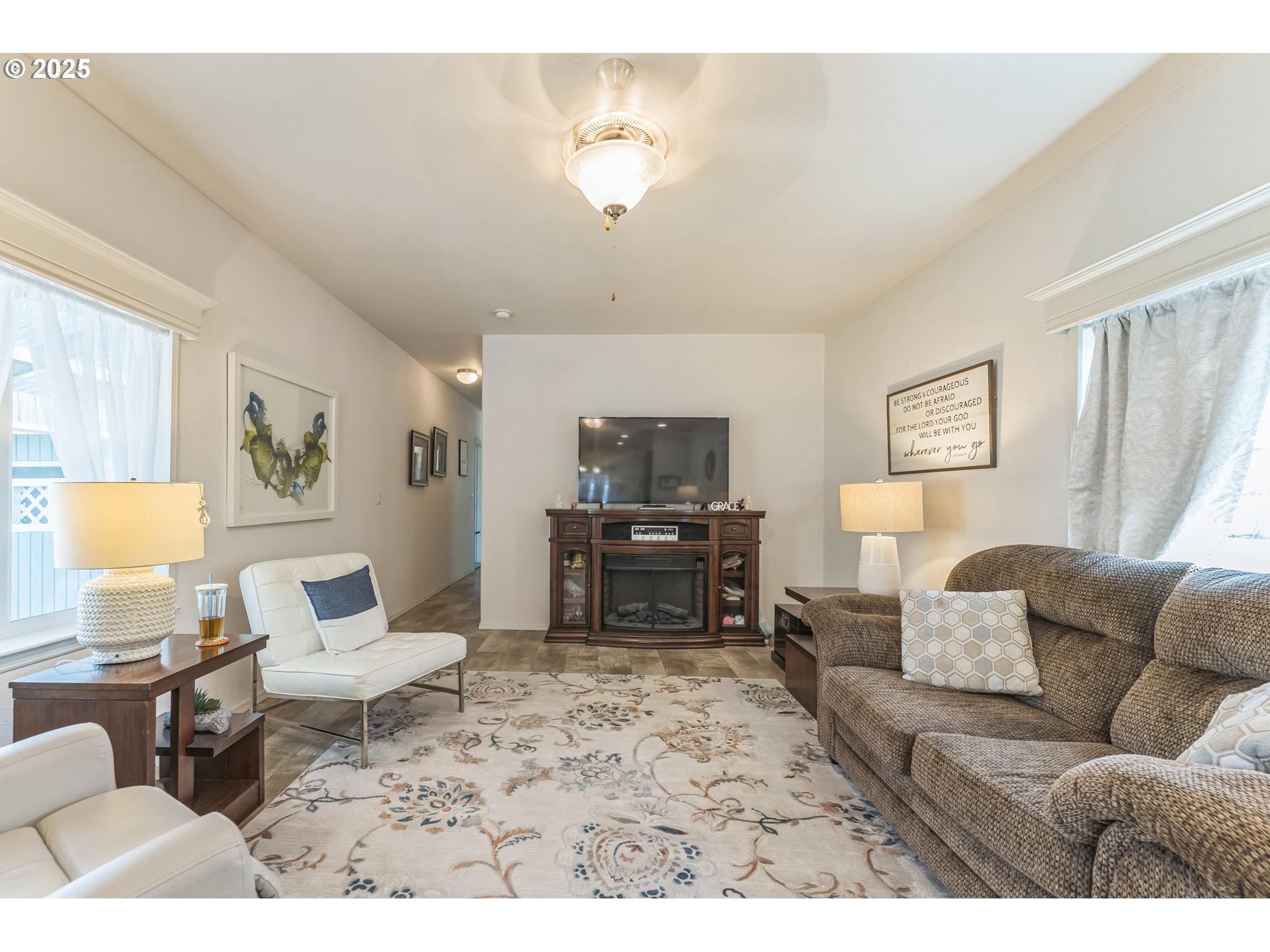 1999 Jansen Way, Unit 29 Woodburn, OR 97071 - Photo 7 of 33 a living room with furniture and a flat screen tv