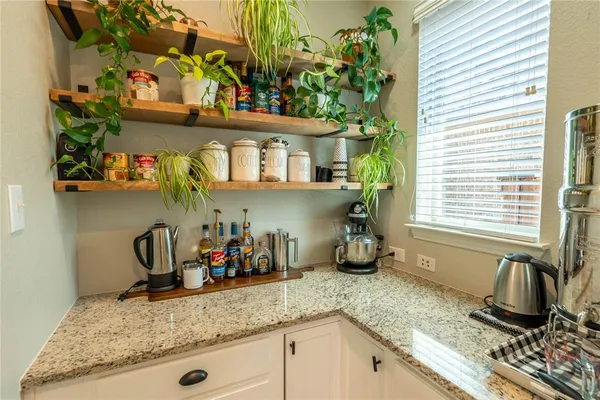 a kitchen with a sink and a stove