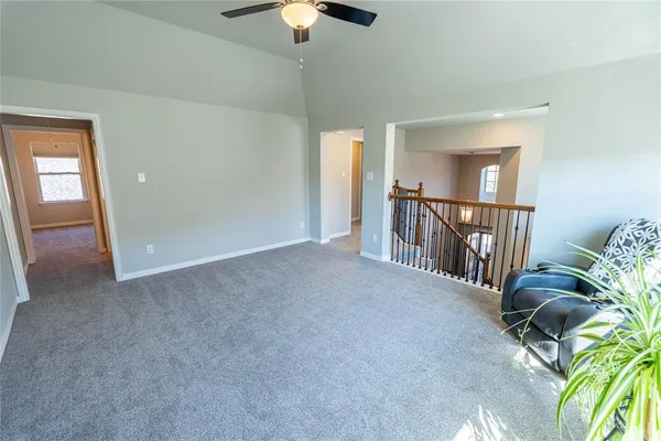 an empty room with closet and wooden floor