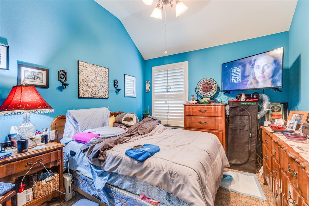 1036 Dunhill Lane Forney, TX 75126 - Photo 17 of 25 a bedroom with bed and wooden floor