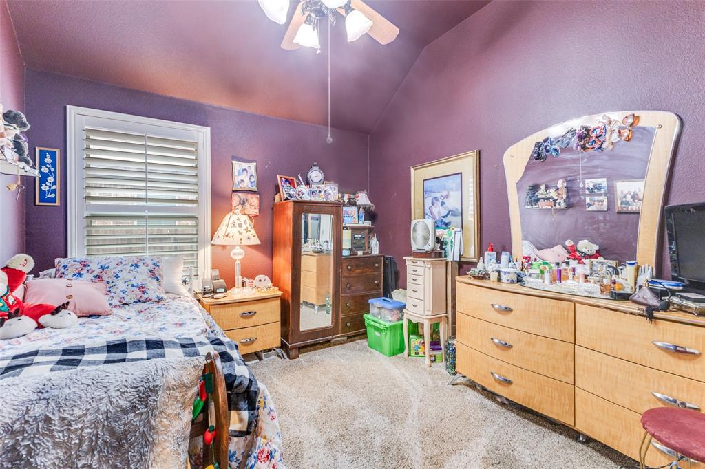 1036 Dunhill Lane Forney, TX 75126 - Photo 18 of 25 a bedroom with furniture and a window