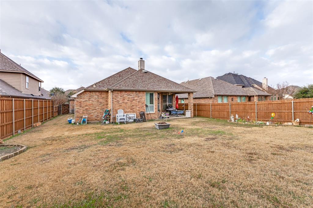 1036 Dunhill Lane Forney, TX 75126 - Photo 25 of 25 a front view of a house with a yard and garage