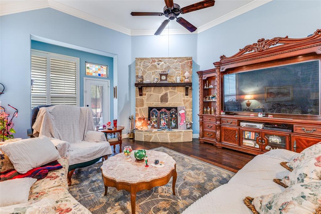 1036 Dunhill Lane Forney, TX 75126 - Photo 5 of 25 a living room with furniture and a flat screen tv
