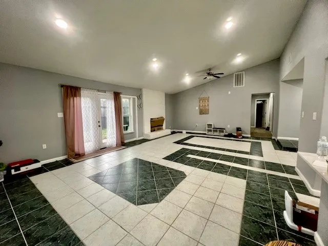 a lobby with a couch and a rug