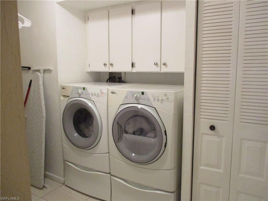 4060 Ice Castle Way, Unit 10 Naples, FL 34112 - Photo 12 of 15 a utility room with dryer and washer