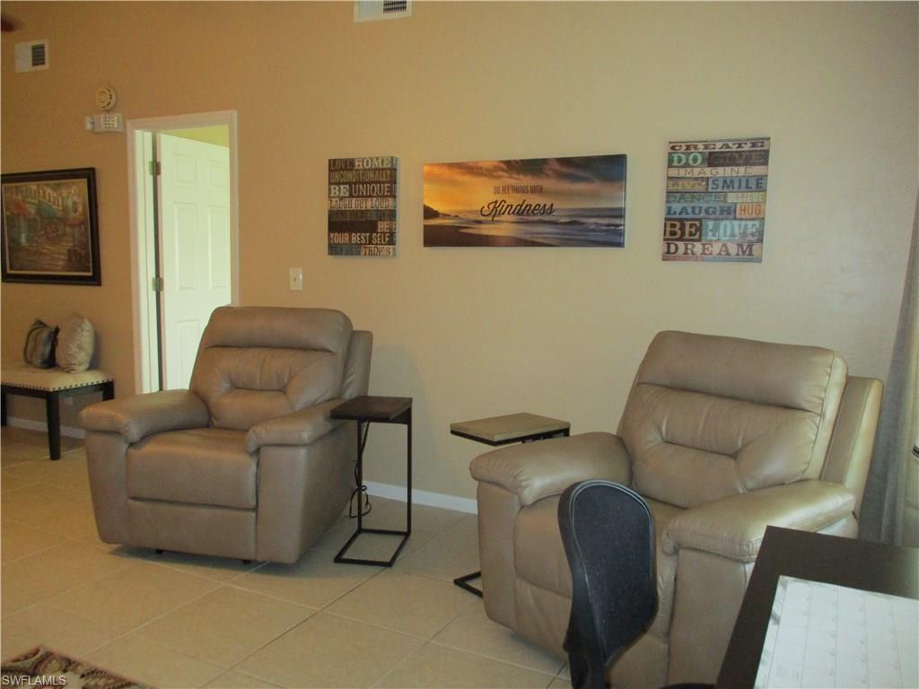 4060 Ice Castle Way, Unit 10 Naples, FL 34112 - Photo 8 of 15 a living room with furniture and a couch