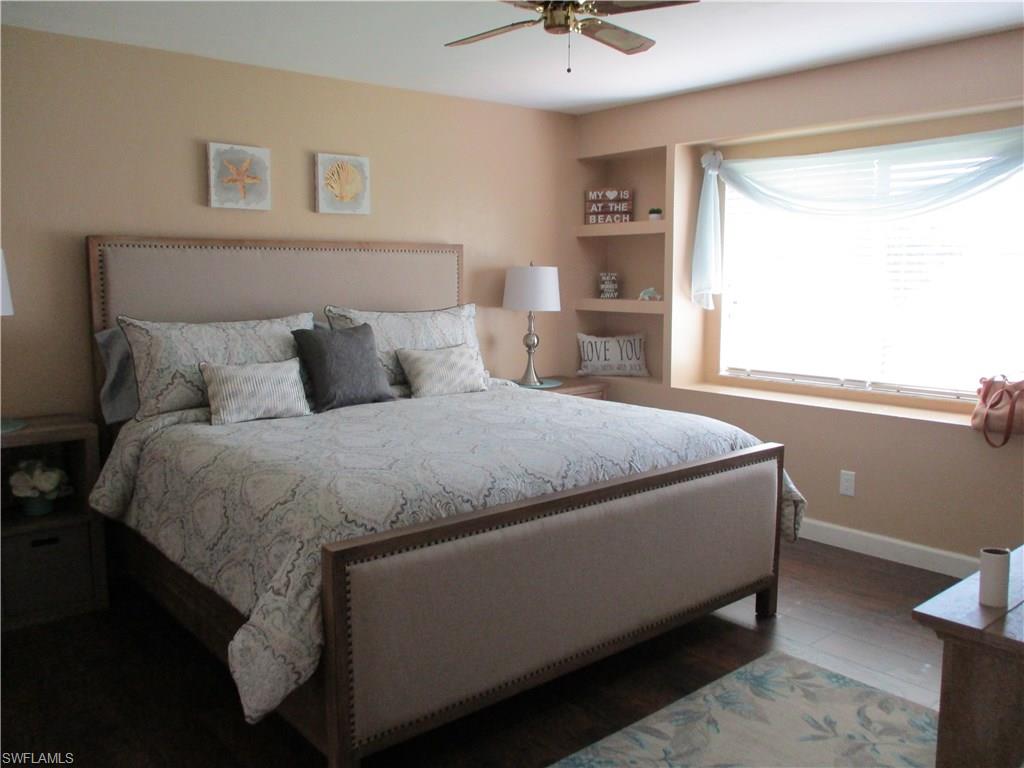 4060 Ice Castle Way, Unit 10 Naples, FL 34112 - Photo 9 of 15 a bedroom with a bed and window