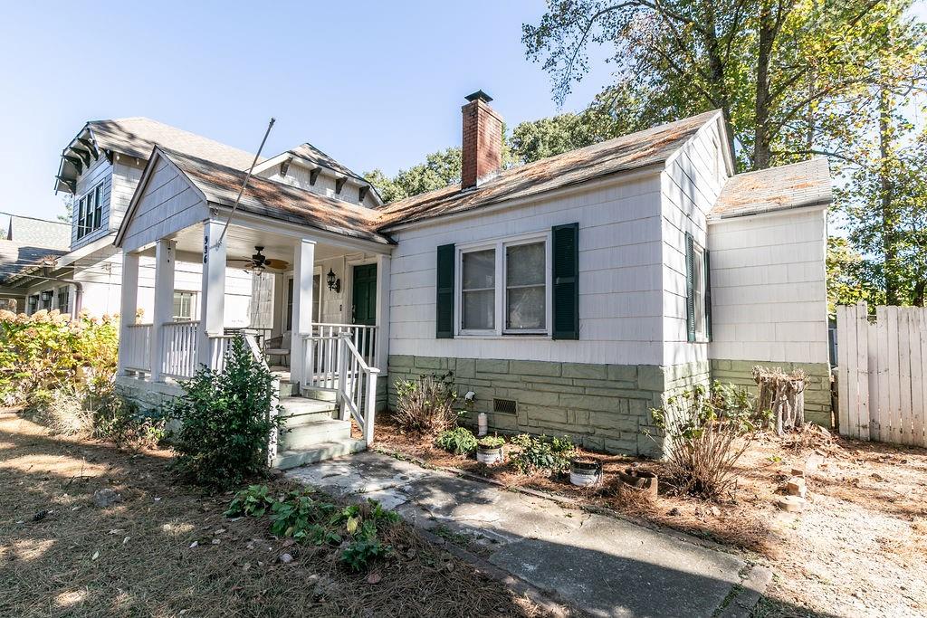 936 East Lake Drive Decatur, GA 30030 - Photo 1 of 50 a front view of a house with garden