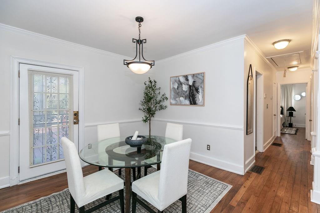 936 East Lake Drive Decatur, GA 30030 - Photo 11 of 50 a view of a dining room with furniture and wooden floor