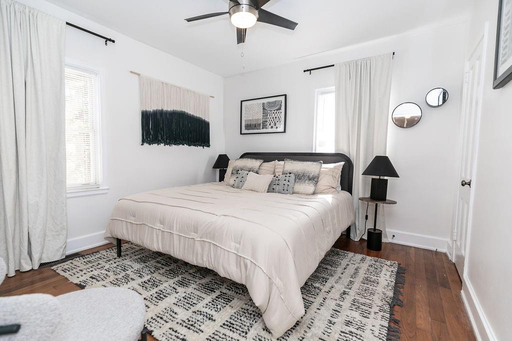 936 East Lake Drive Decatur, GA 30030 - Photo 18 of 50 a bedroom with a bed and a chandelier