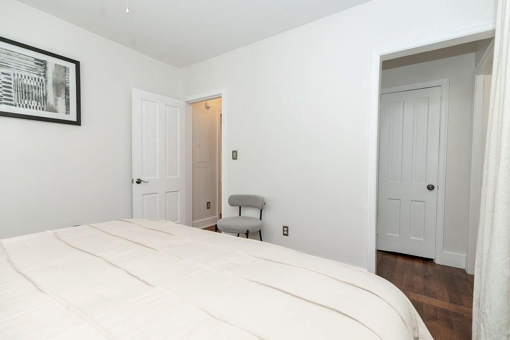 936 East Lake Drive Decatur, GA 30030 - Photo 21 of 50 a bedroom with a bed and hallway