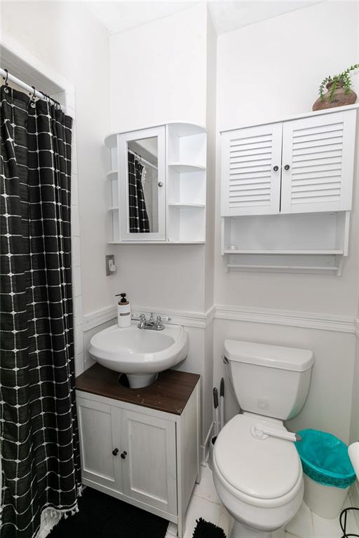 936 East Lake Drive Decatur, GA 30030 - Photo 25 of 50 a bathroom with a sink toilet and shower