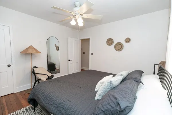 a bedroom with furniture and a chandelier