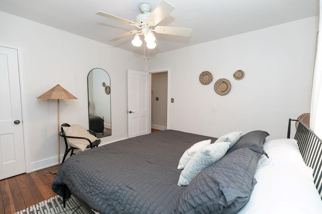 936 East Lake Drive Decatur, GA 30030 - Photo 28 of 50 a bedroom with a bed and a chandelier