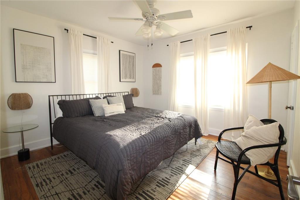 936 East Lake Drive Decatur, GA 30030 - Photo 43 of 50 a bedroom with a bed and chair