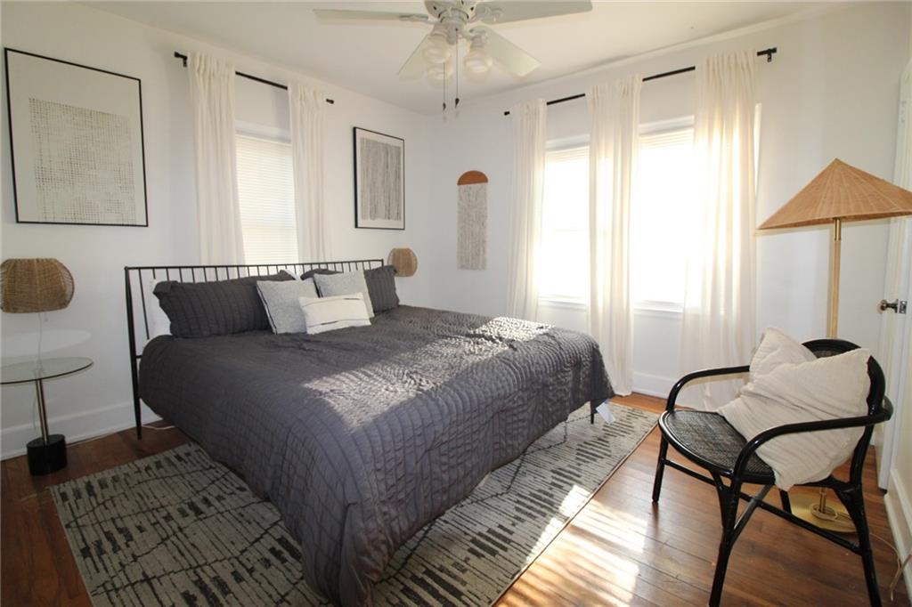 936 East Lake Drive Decatur, GA 30030 - Photo 44 of 50 a bedroom with a bed and a chandelier