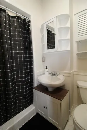 a view of a deck with two chairs and wooden floor