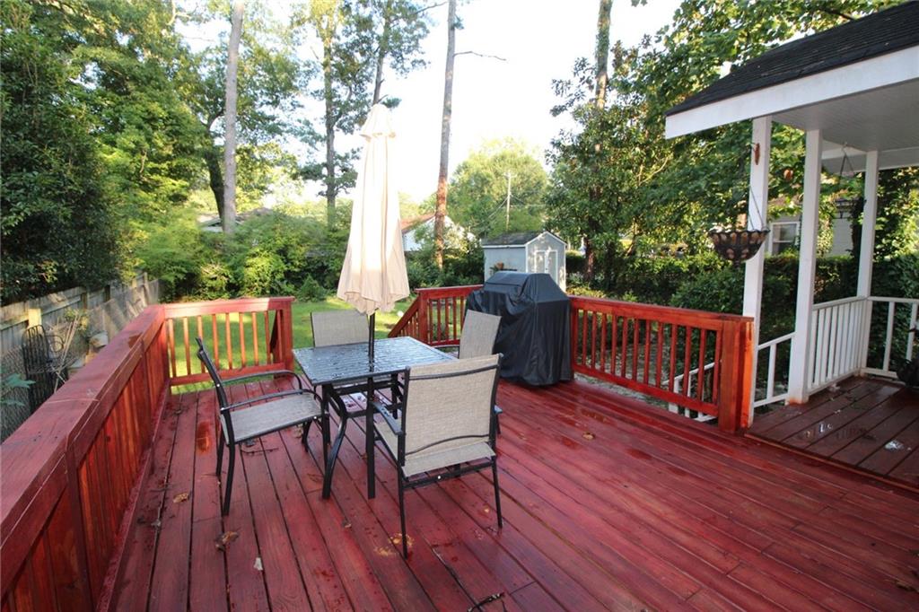 936 East Lake Drive Decatur, GA 30030 - Photo 46 of 50 a view of a deck with two chairs and wooden floor