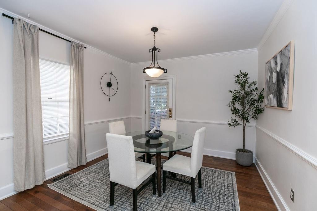 936 East Lake Drive Decatur, GA 30030 - Photo 10 of 50 a dining room with furniture potted plants and wooden floor