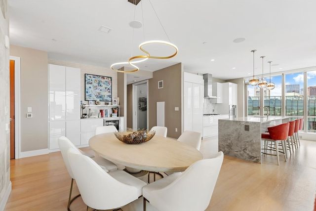 a dining room with furniture and wooden floor