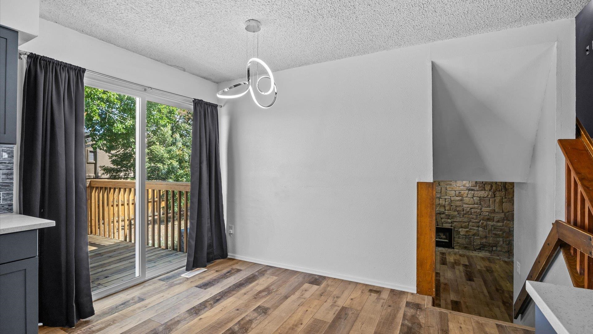 386 Ridge Cir Drive Grand Junction, CO 81507 - Photo 15 of 33 an empty room with wooden floor and windows