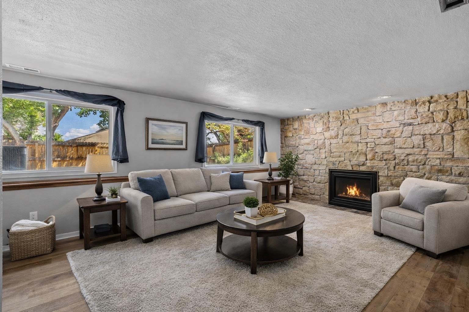 386 Ridge Cir Drive Grand Junction, CO 81507 - Photo 16 of 33 a living room with furniture a fireplace and a large window