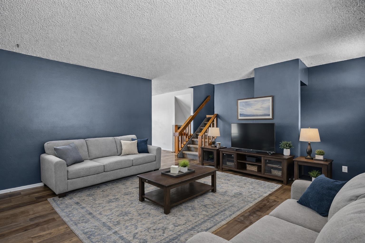 386 Ridge Cir Drive Grand Junction, CO 81507 - Photo 18 of 33 a living room with furniture and a flat screen tv