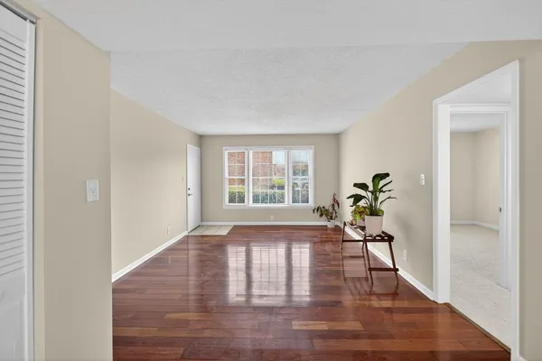 a view of an empty room and window