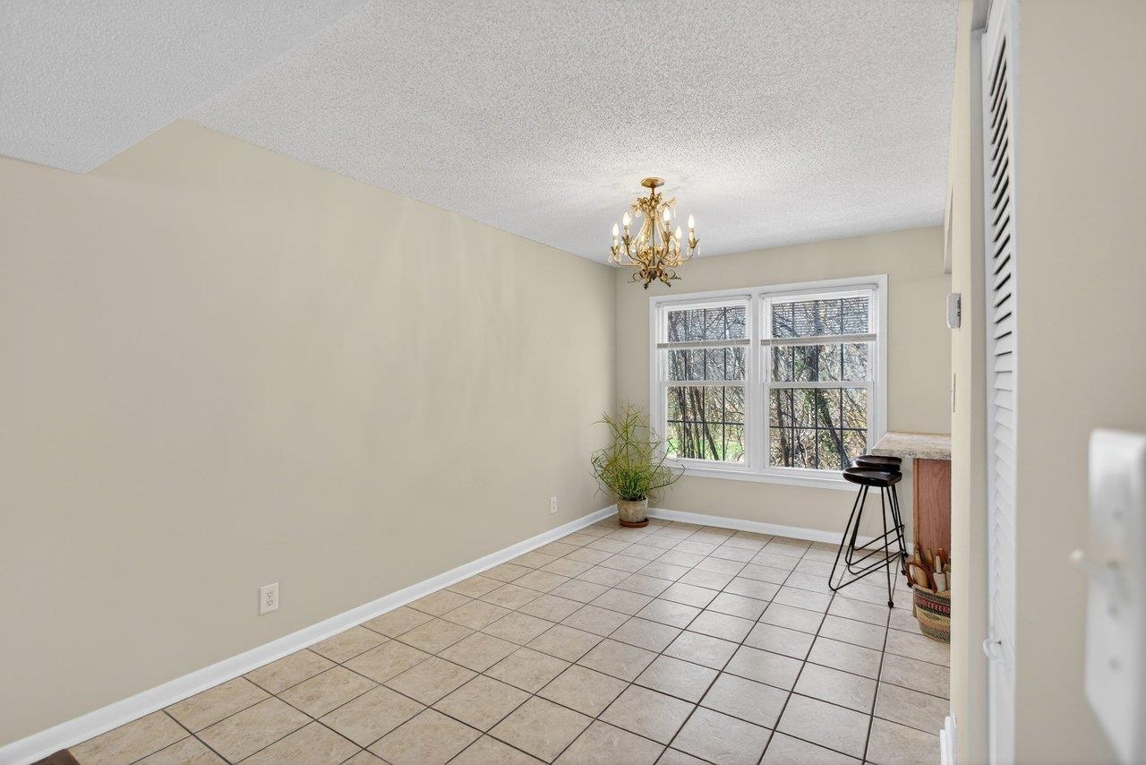 2527 Hydraulic Road, Unit 26 Charlottesville, VA 22901 - Photo 12 of 56 a view of an empty room with a window