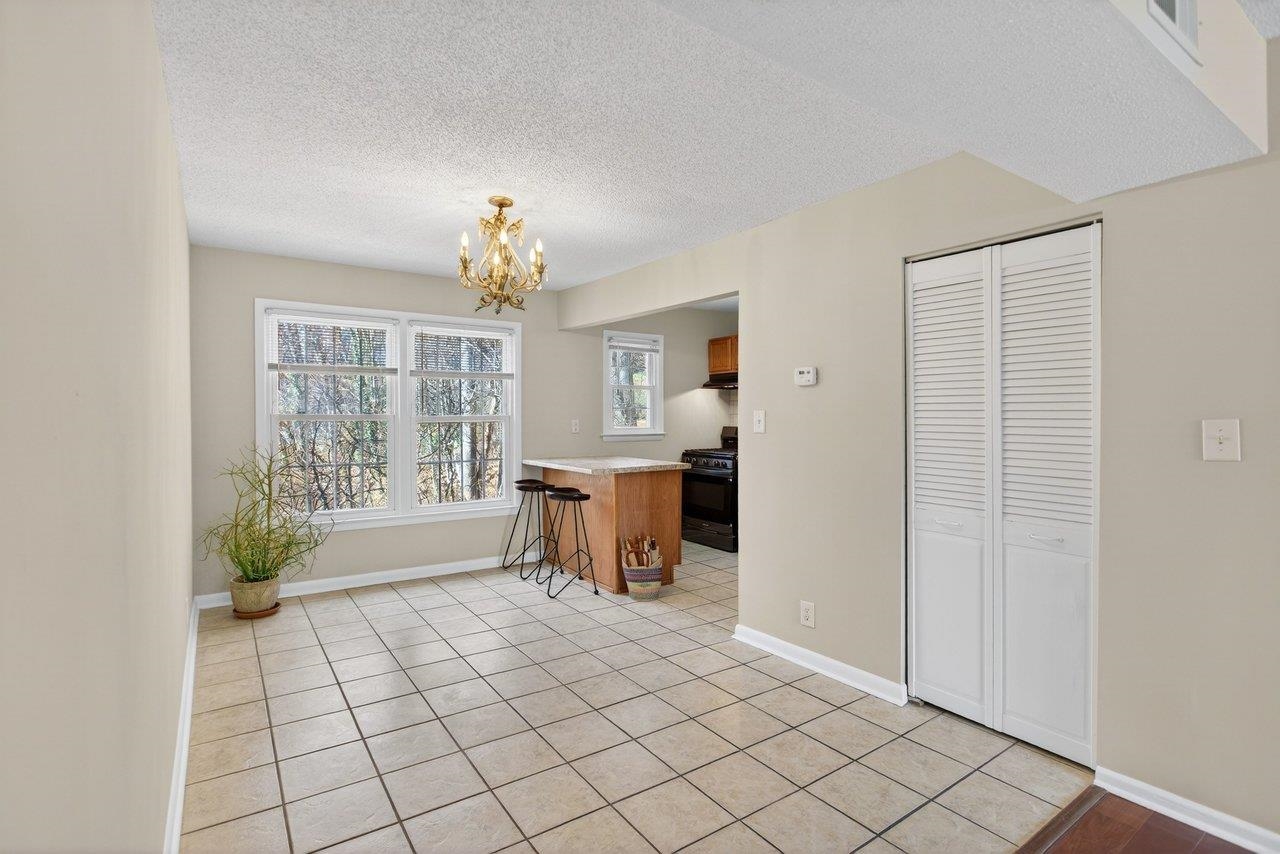 2527 Hydraulic Road, Unit 26 Charlottesville, VA 22901 - Photo 13 of 56 a view of an empty room with a window