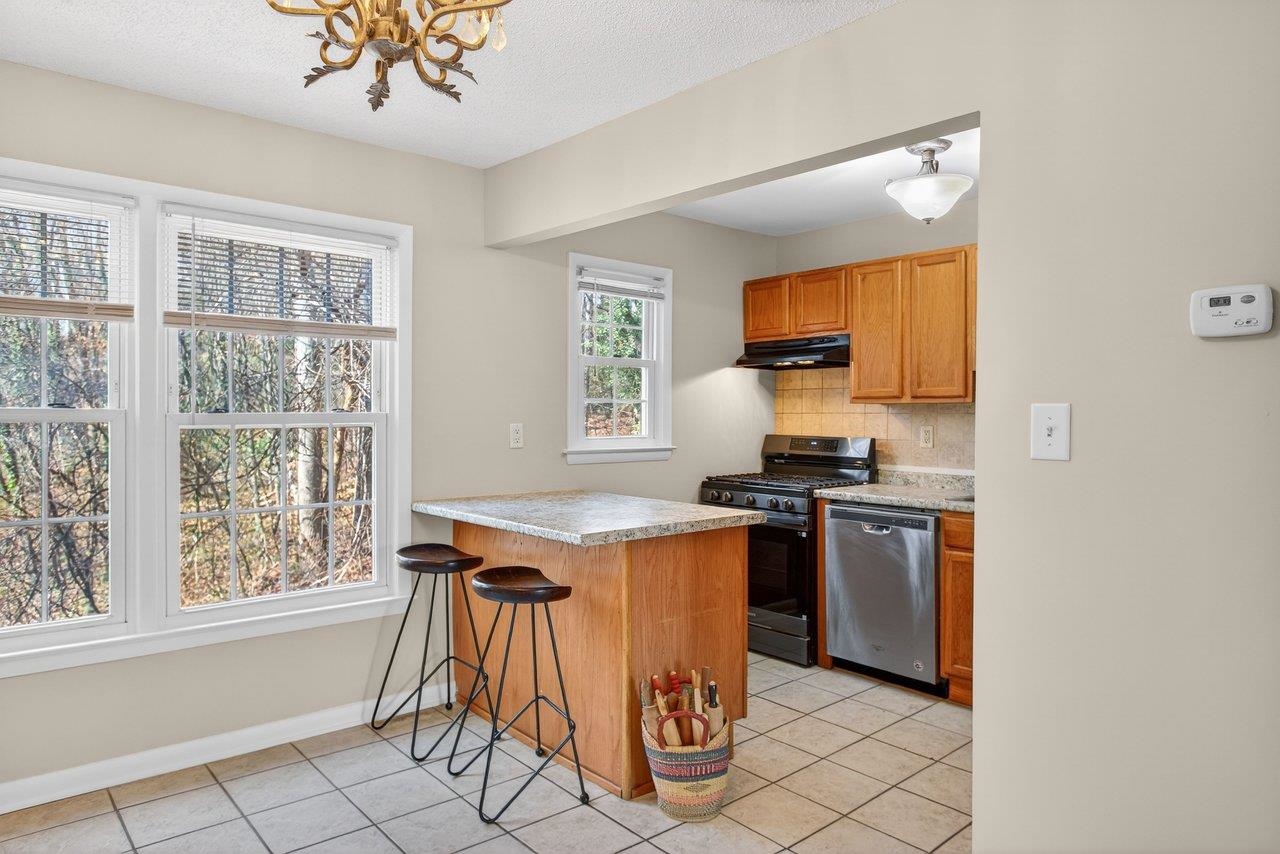 2527 Hydraulic Road, Unit 26 Charlottesville, VA 22901 - Photo 14 of 56 a kitchen with stainless steel appliances granite countertop a stove a sink and a refrigerator