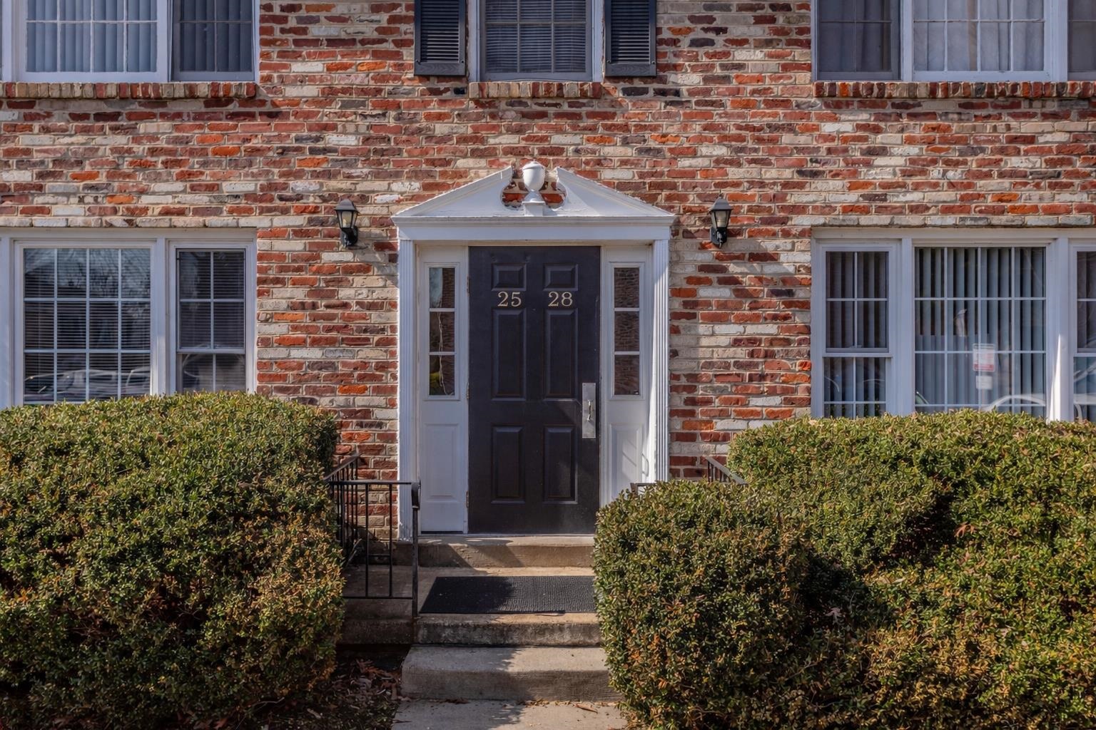 2527 Hydraulic Road, Unit 26 Charlottesville, VA 22901 - Photo 2 of 56 a front view of a house with a garden