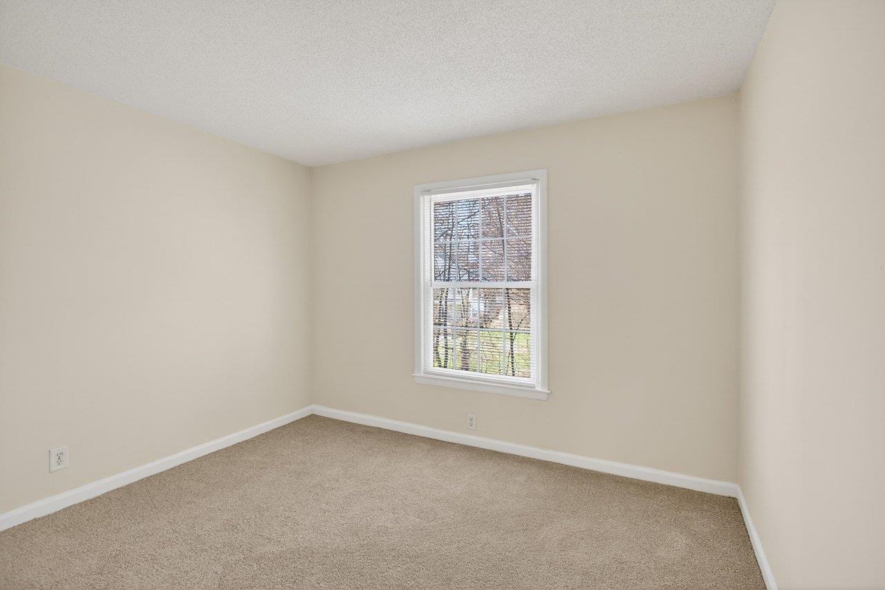 2527 Hydraulic Road, Unit 26 Charlottesville, VA 22901 - Photo 23 of 56 an empty room with a window