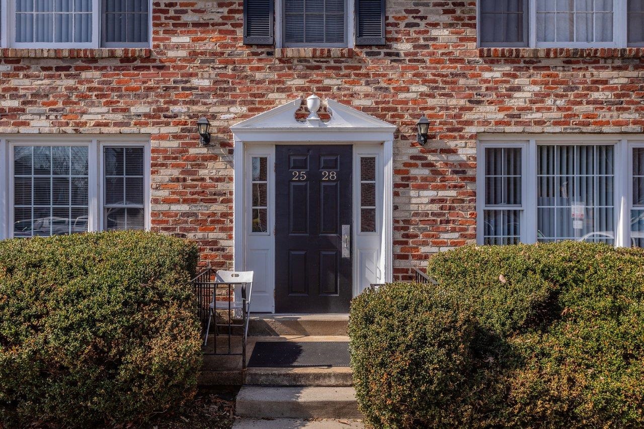 2527 Hydraulic Road, Unit 26 Charlottesville, VA 22901 - Photo 49 of 56 a front view of a house with a garden