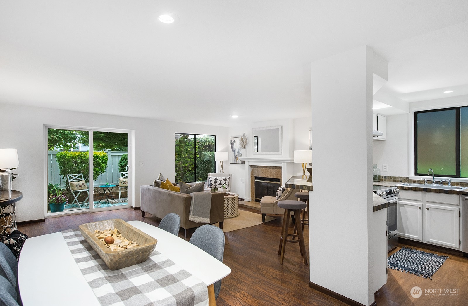 a living room with furniture fireplace and flat screen tv