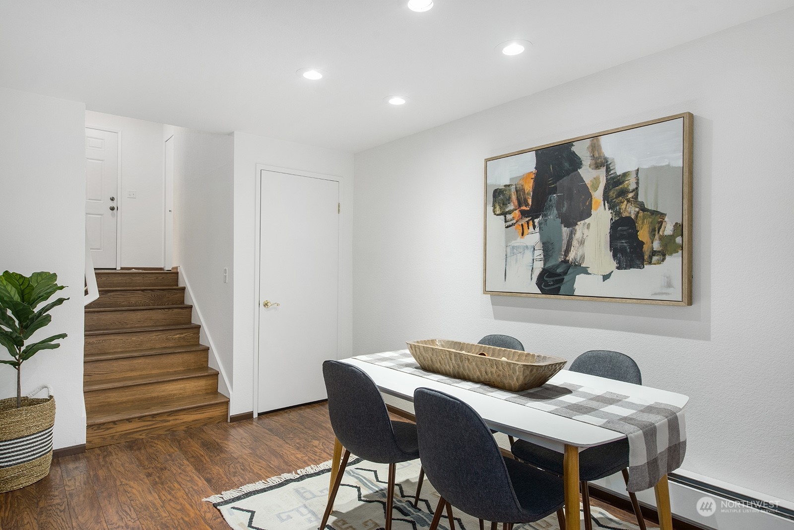 3030 63rd Avenue Southwest, Unit 2 Seattle, WA 98116 - Photo 11 of 32 a view of a dining room with furniture and wooden floor