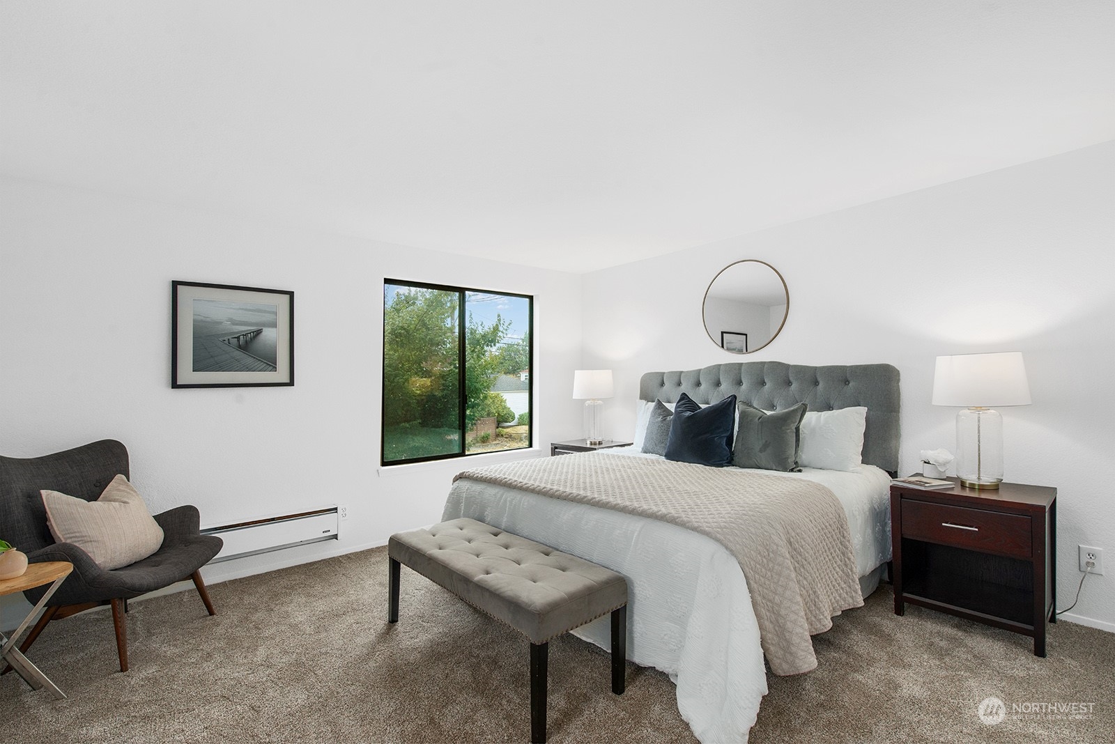 3030 63rd Avenue Southwest, Unit 2 Seattle, WA 98116 - Photo 19 of 32 a bedroom with bed and a window