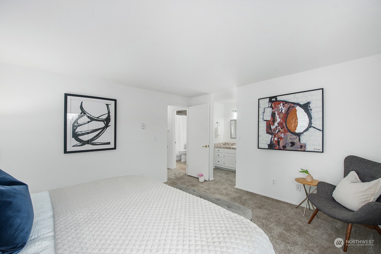 3030 63rd Avenue Southwest, Unit 2 Seattle, WA 98116 - Photo 20 of 32 a bedroom with a bed and a painting on the wall