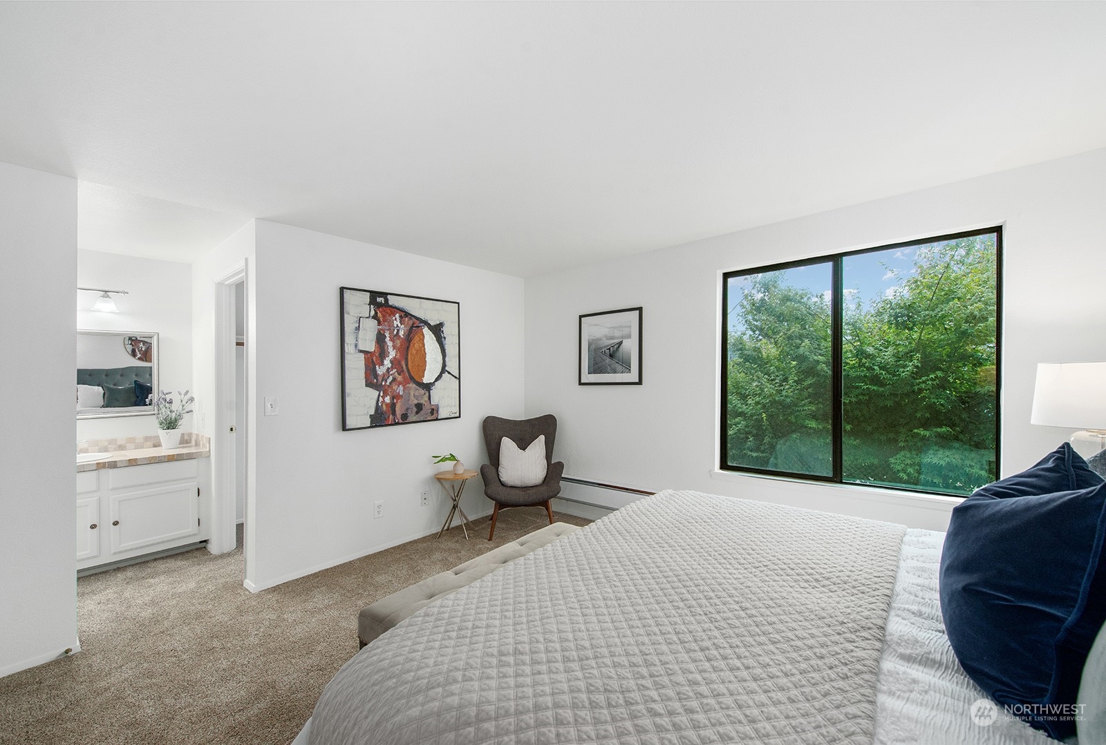 3030 63rd Avenue Southwest, Unit 2 Seattle, WA 98116 - Photo 21 of 32 a bedroom with a large bed and a large window