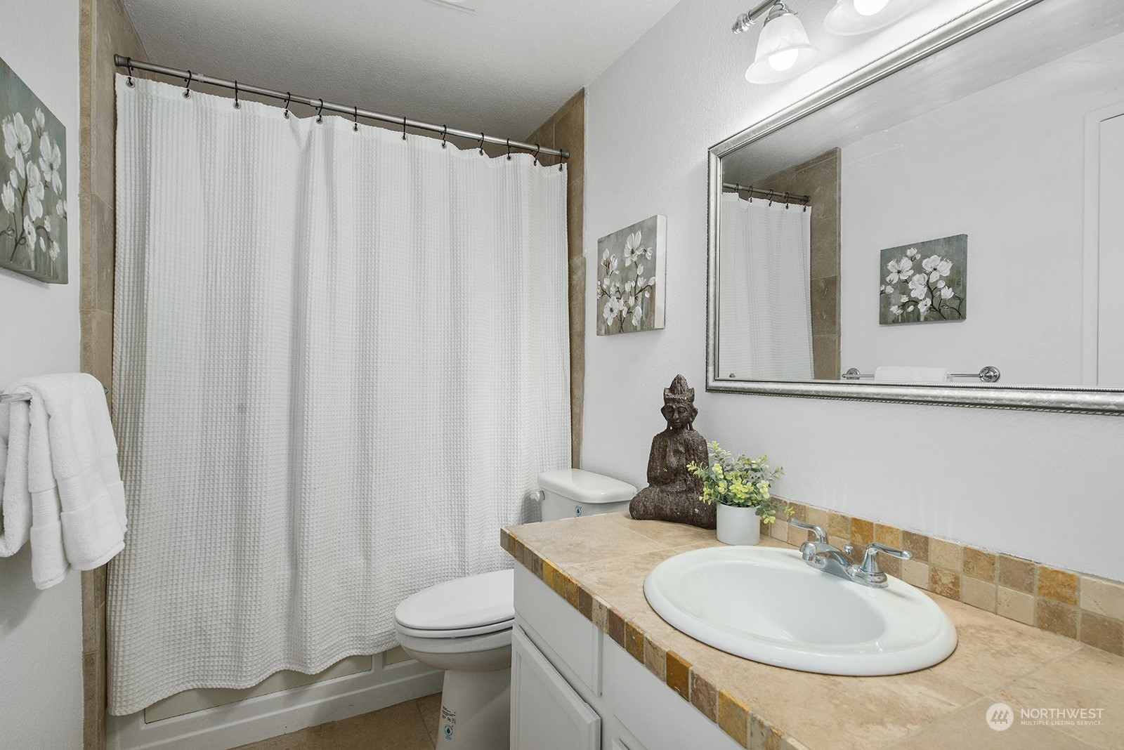 3030 63rd Avenue Southwest, Unit 2 Seattle, WA 98116 - Photo 24 of 32 a bathroom with a sink toilet and a mirror